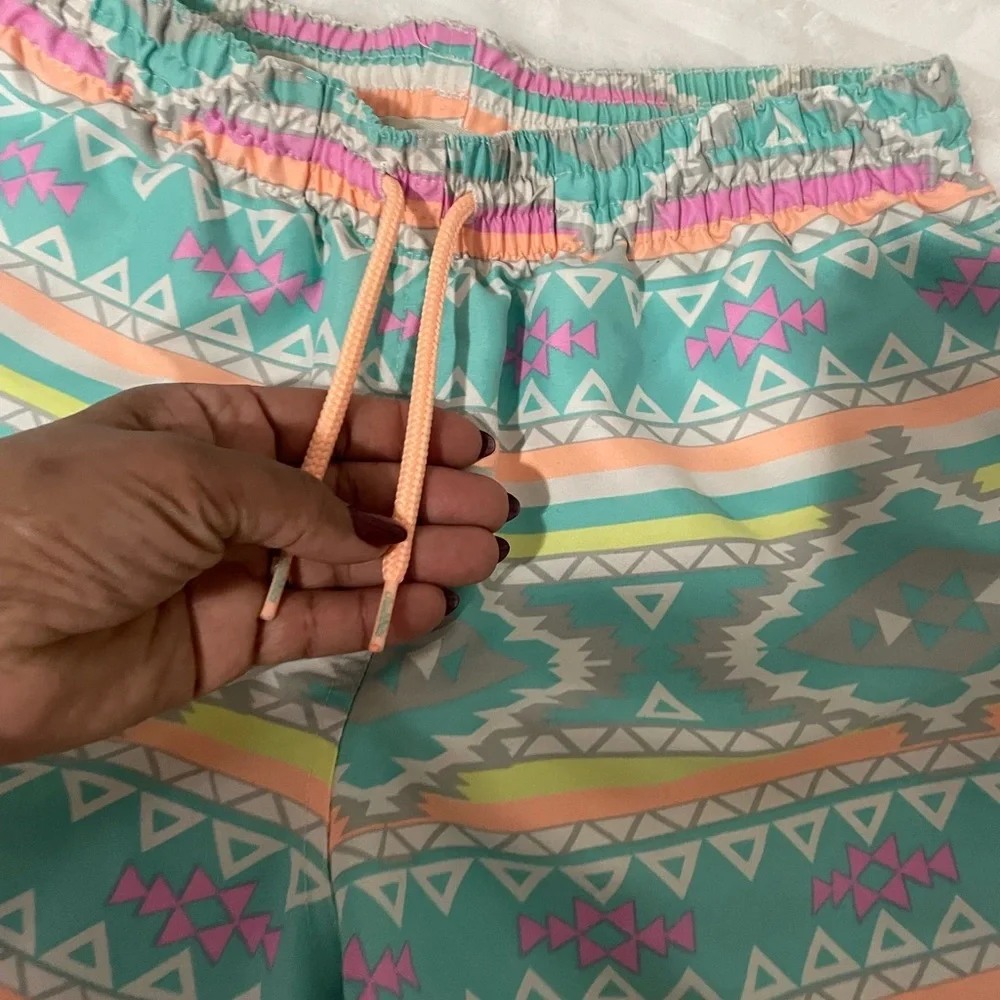 chubbies Turquoise Aztec Swim Trunks with Pink and Yellow Accents